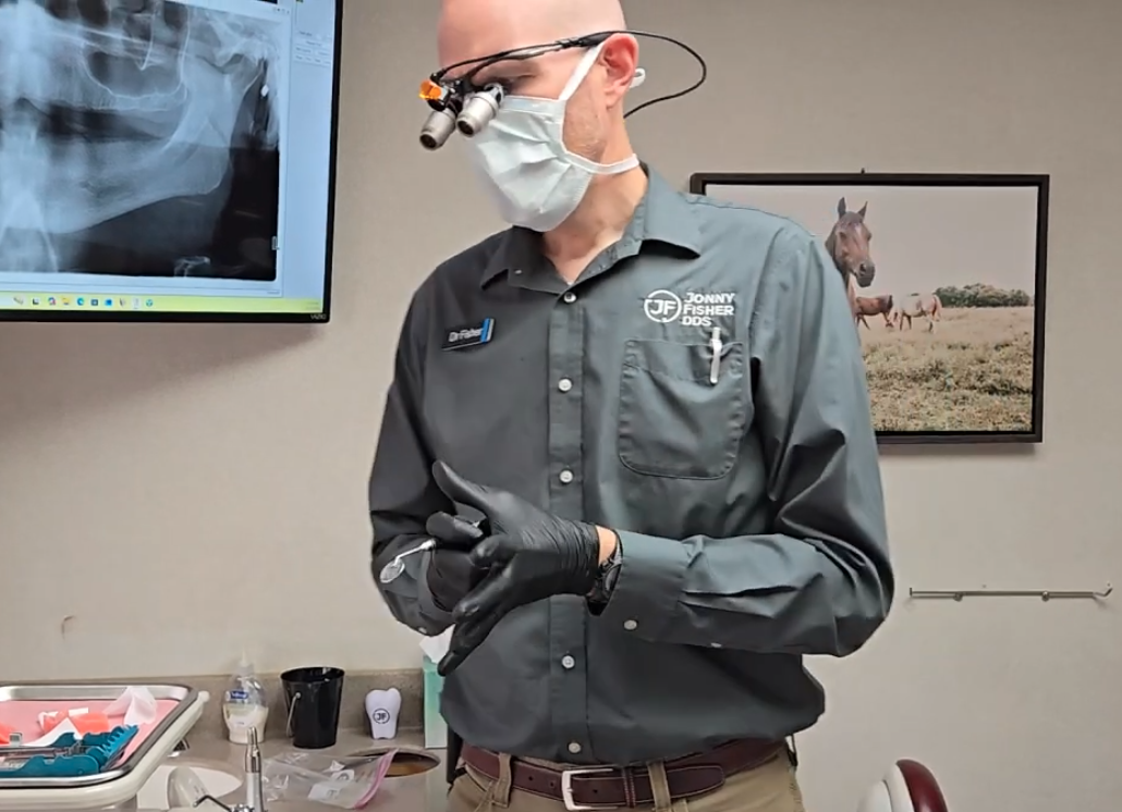 Dr. Jonny Fisher treating a patient at his Pullman dental office